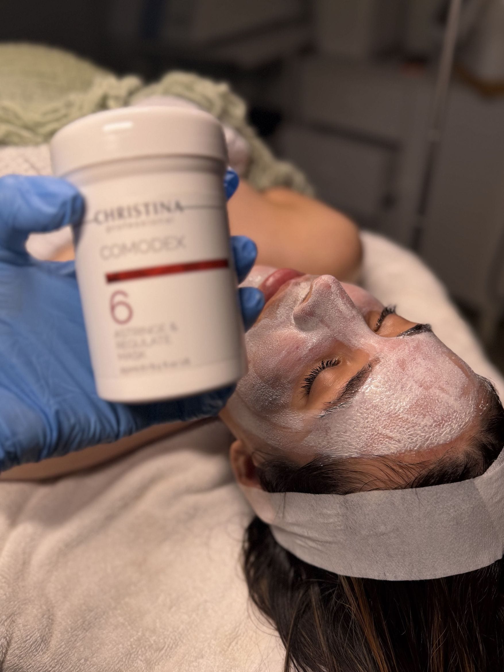 A professional Christina Comodex mask during a facial