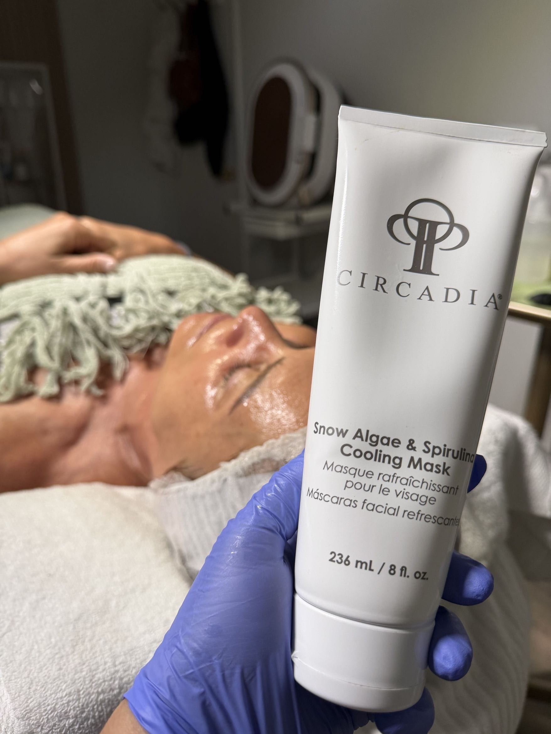 A Circadia cooling mask held up during a facial